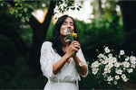 Woman smelling flowers